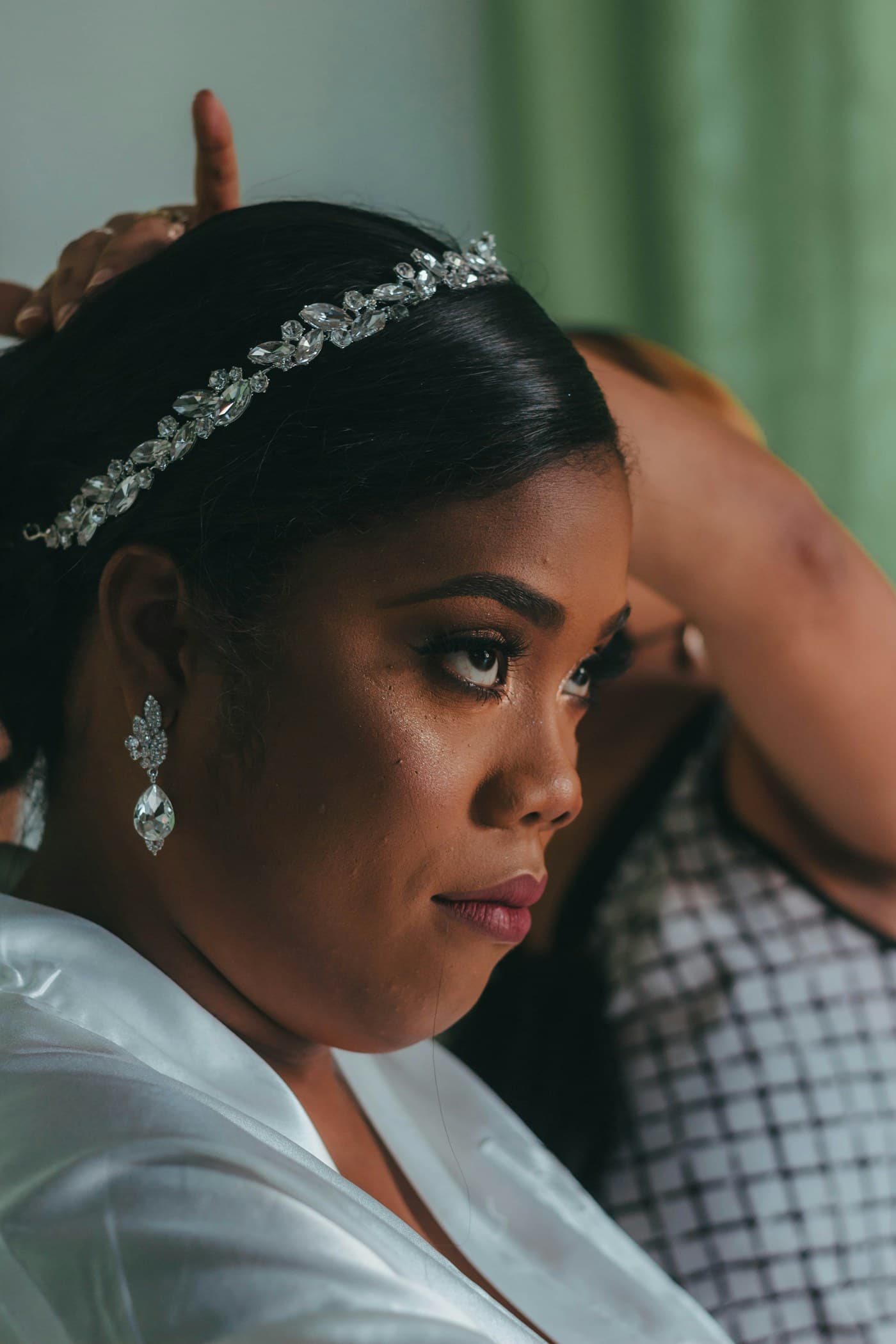 Bride in a jewelled headband during her makeup