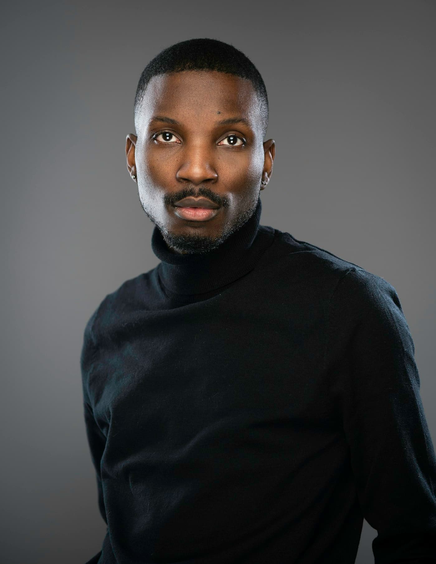 Man in a black turtleneck, studio portrait